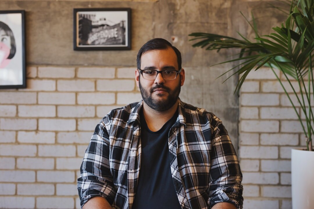 Portrait of a Belgian entrepreneur smiling in an office setting